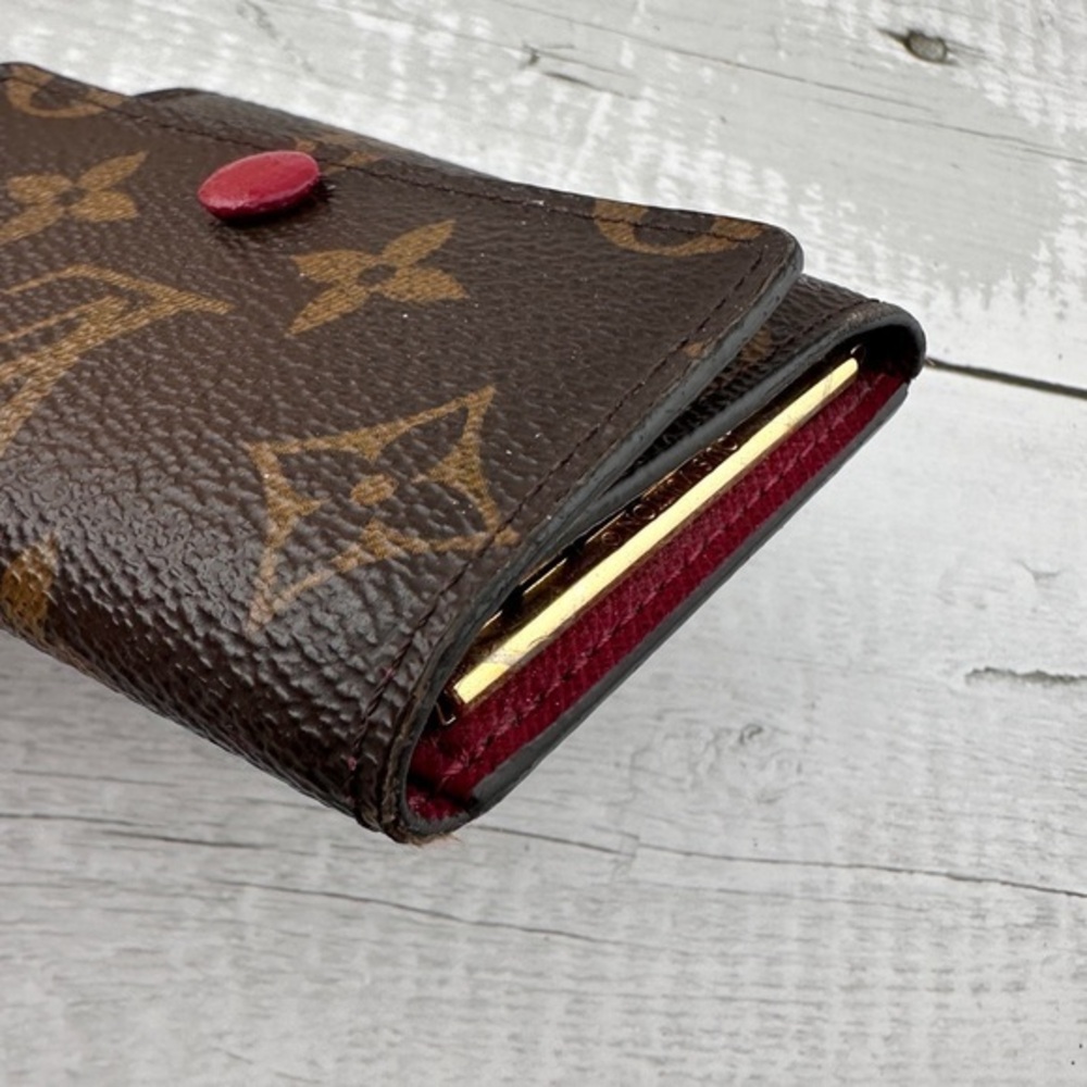 AUTHENTIC Louis Vuitton key holder. Monogram pattern. Magenta interior. - Picture 11 of 15
